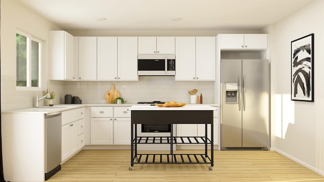 kitchen featuring sink, backsplash, white cabinets, and stainless steel refrigerator with ice dispenser