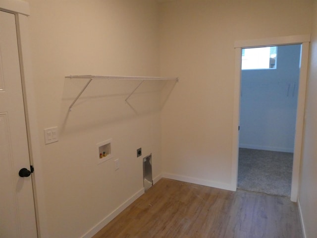 clothes washing area featuring hookup for a washing machine, hookup for an electric dryer, and light wood-type flooring