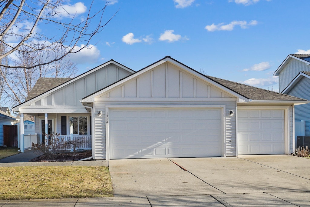 view of front of property featuring a garage and covered porch