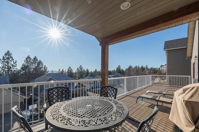 wooden terrace featuring a grill