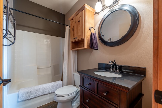 full bathroom with vanity, shower / tub combo with curtain, and toilet