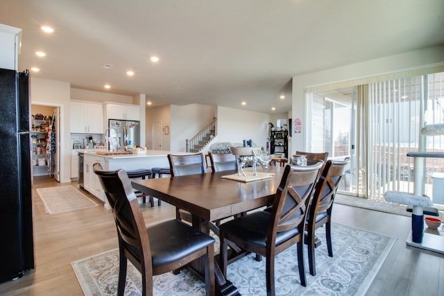 dining room with light wood-type flooring