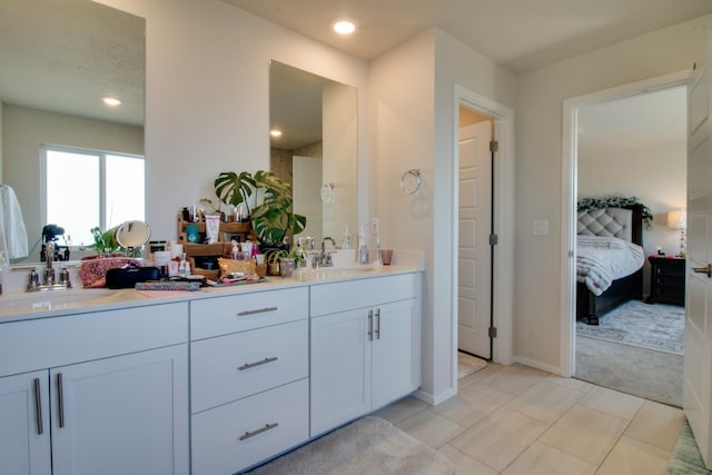 bathroom with tile patterned floors and vanity