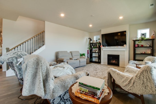 living room featuring hardwood / wood-style flooring and a fireplace