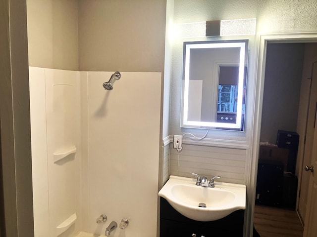 bathroom featuring vanity and shower / bathtub combination