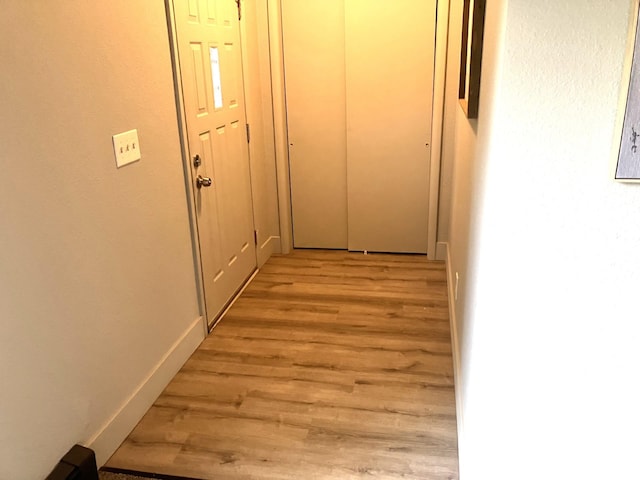 hallway featuring light wood-type flooring