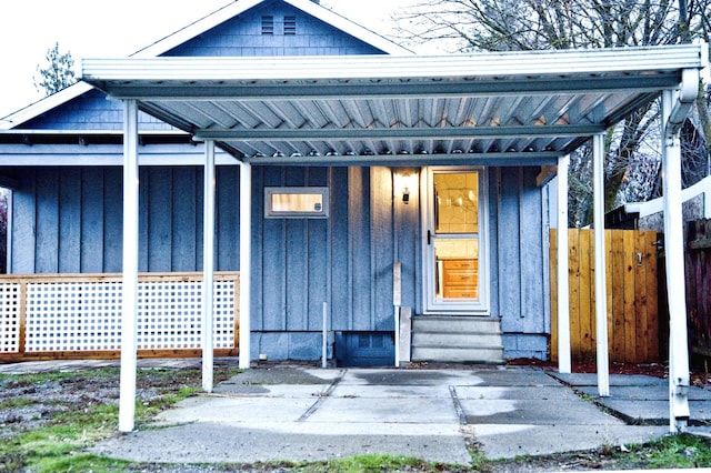 entrance to property with a carport