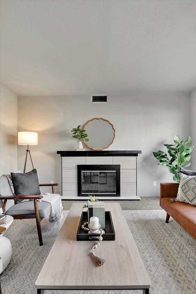 living room with light colored carpet