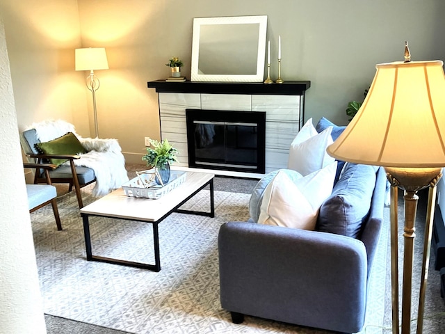 carpeted living room featuring a fireplace