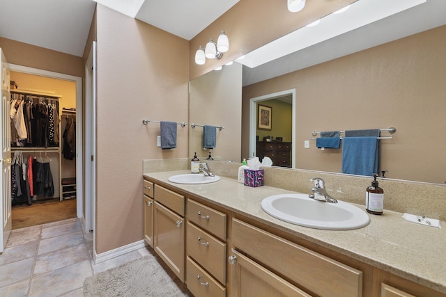 bathroom with vanity and tile patterned flooring