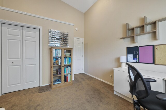 office area featuring lofted ceiling and carpet