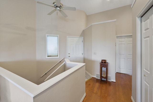 corridor featuring dark hardwood / wood-style floors