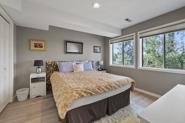 bedroom featuring a closet and light wood-type flooring