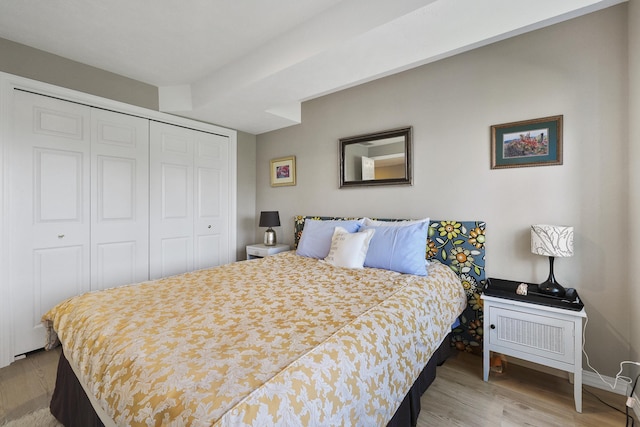 bedroom featuring a closet and light hardwood / wood-style flooring