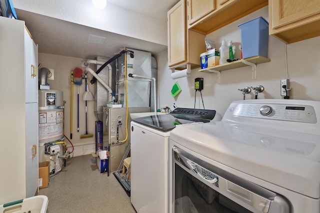 laundry area with heating unit, cabinets, water heater, and washing machine and clothes dryer