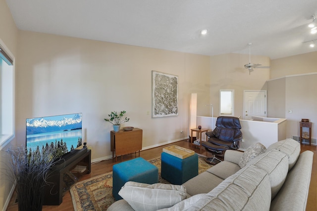 living room with plenty of natural light and hardwood / wood-style floors