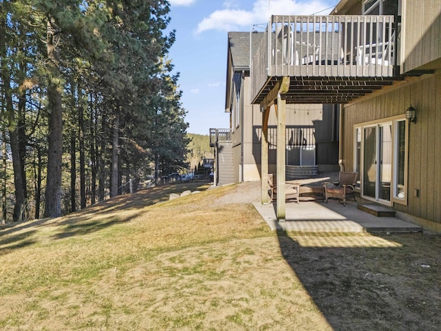 view of yard featuring a patio area, stairway, and a deck