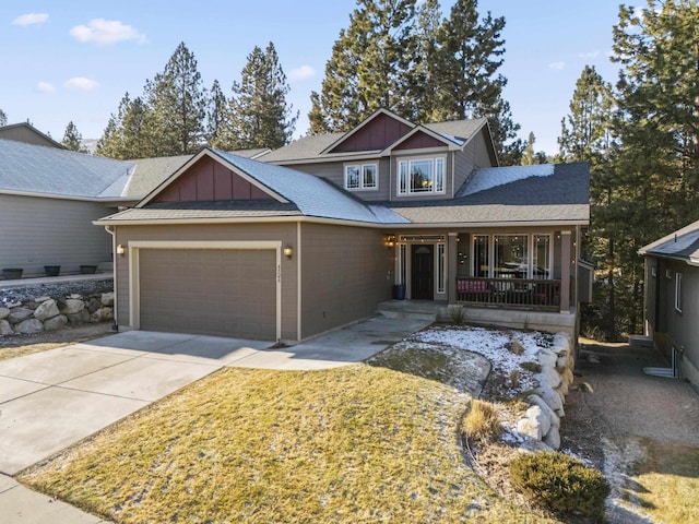 view of front facade featuring a porch, a shingled roof, concrete driveway, an attached garage, and board and batten siding