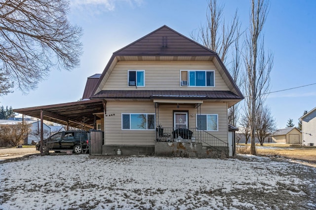 view of front of property with a carport and covered porch