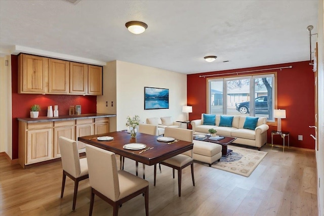 dining area with light hardwood / wood-style flooring