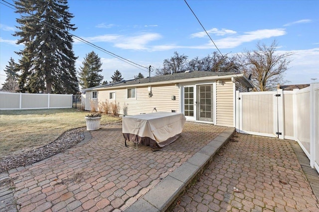 rear view of property featuring a patio area