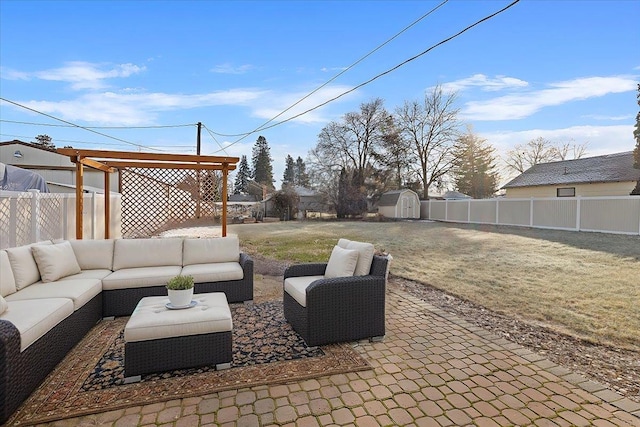 view of patio / terrace with outdoor lounge area and a storage unit