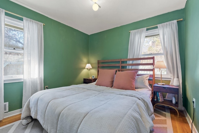 bedroom with hardwood / wood-style flooring