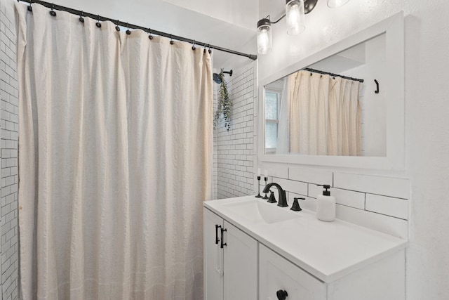 bathroom featuring tasteful backsplash, vanity, and a shower with shower curtain