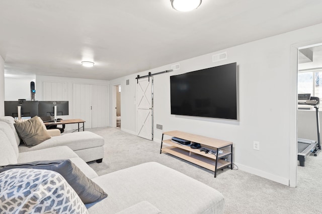 carpeted living room with a barn door