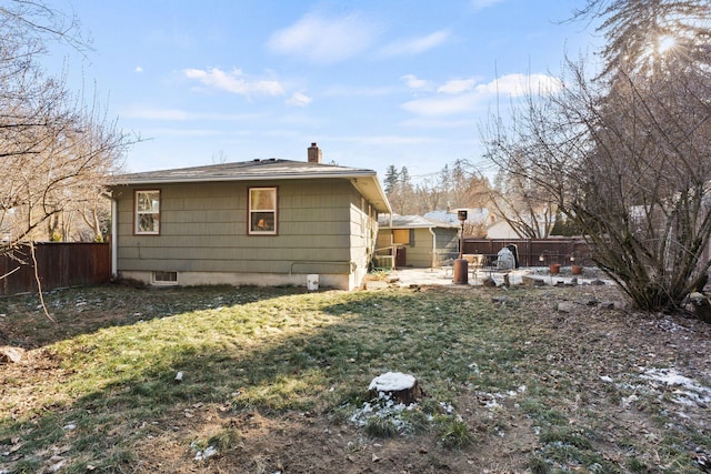 rear view of house with a lawn