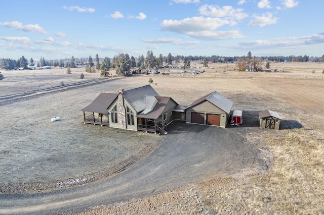 birds eye view of property with a rural view