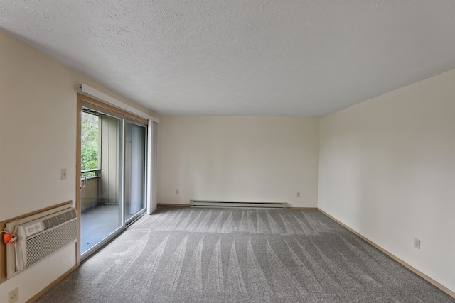 carpeted empty room featuring a baseboard radiator, a wall unit AC, and a textured ceiling