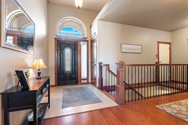 entryway featuring light wood-style flooring and baseboards