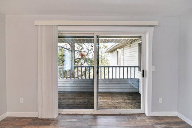 entryway with dark wood-type flooring