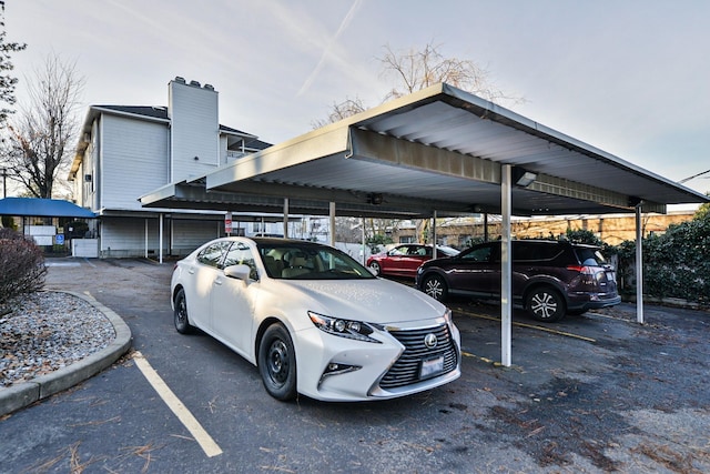 view of vehicle parking featuring a carport