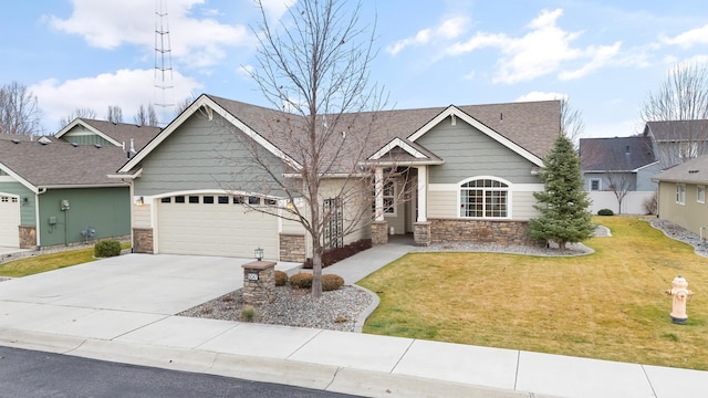 craftsman inspired home with a garage and a front lawn