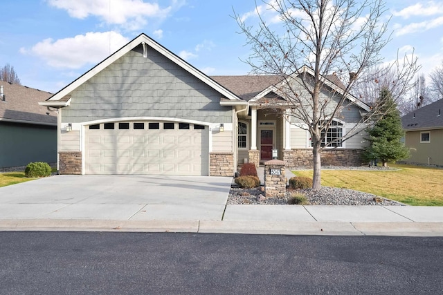 craftsman house with a garage and a front yard