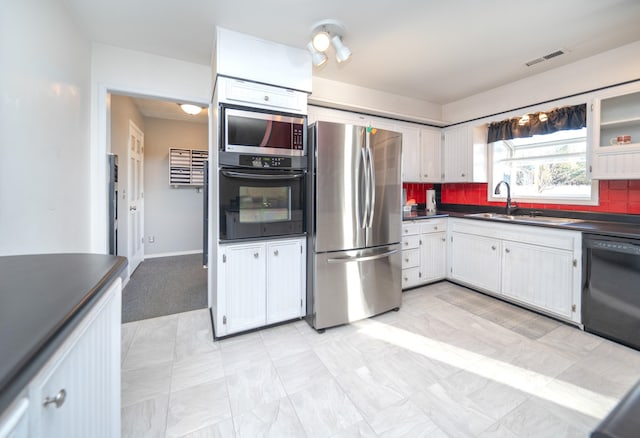 3732 E Westwood Ave, Chattaroy, WA 99003 - kitchen featuring a sink, dark countertops, visible vents, black appliances, and decorative backsplash