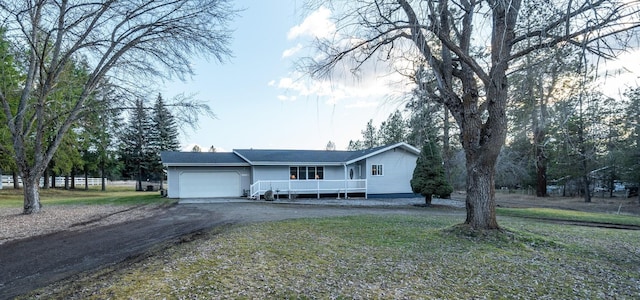 3732 E Westwood Ave, Chattaroy, WA 99003 - ranch-style home featuring aphalt driveway and an attached garage