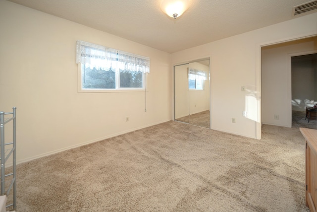 3732 E Westwood Ave, Chattaroy, WA 99003 - unfurnished bedroom with carpet, visible vents, baseboards, and a closet