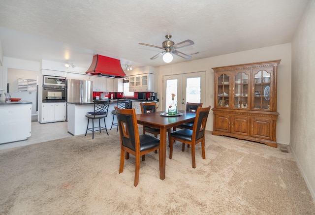 3732 E Westwood Ave, Chattaroy, WA 99003 - dining room featuring baseboards, light carpet, and ceiling fan