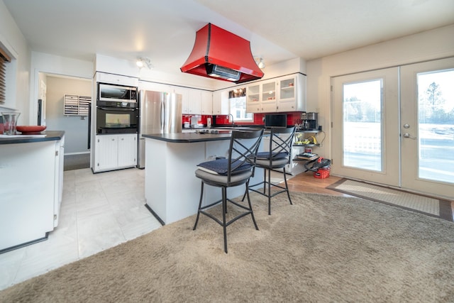 3732 E Westwood Ave, Chattaroy, WA 99003 - kitchen featuring a healthy amount of sunlight, dark countertops, french doors, and appliances with stainless steel finishes