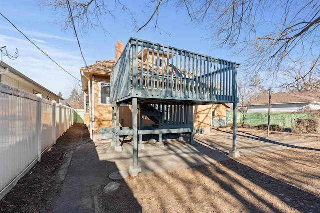 rear view of house with a wooden deck