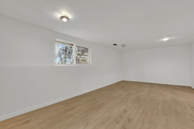 spare room with light hardwood / wood-style flooring