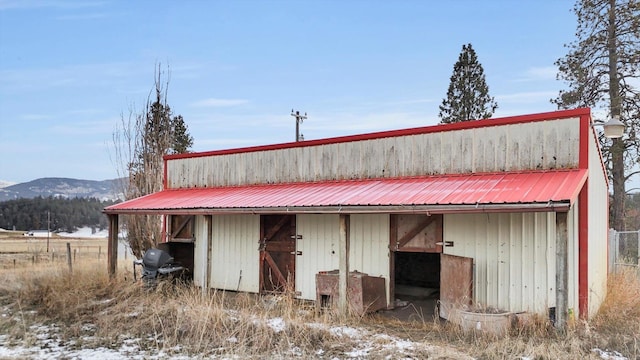 view of outbuilding featuring a mountain view