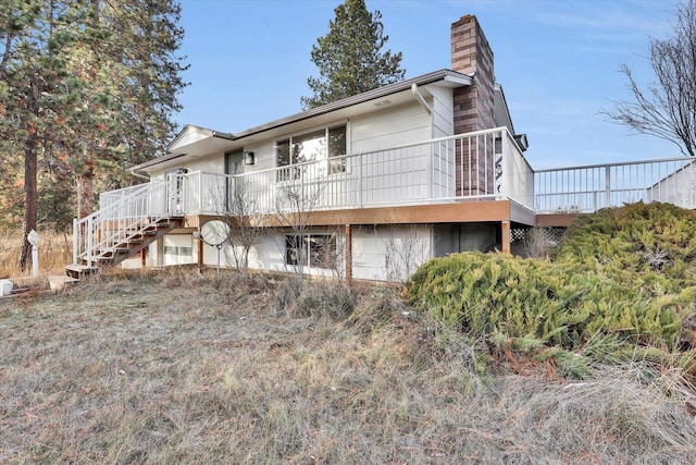 back of house featuring a deck