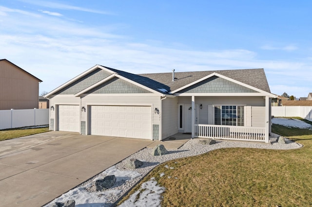 view of front facade featuring a garage and a front lawn