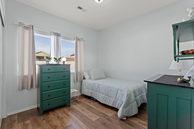 bedroom with hardwood / wood-style floors