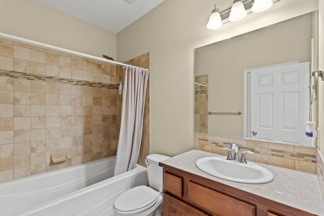 full bathroom featuring tasteful backsplash, toilet, vanity, and shower / bath combo with shower curtain