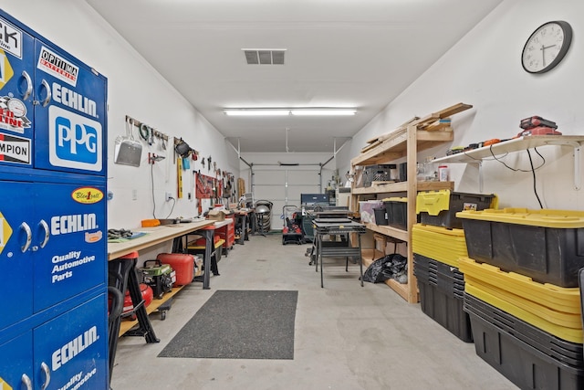 garage with a workshop area